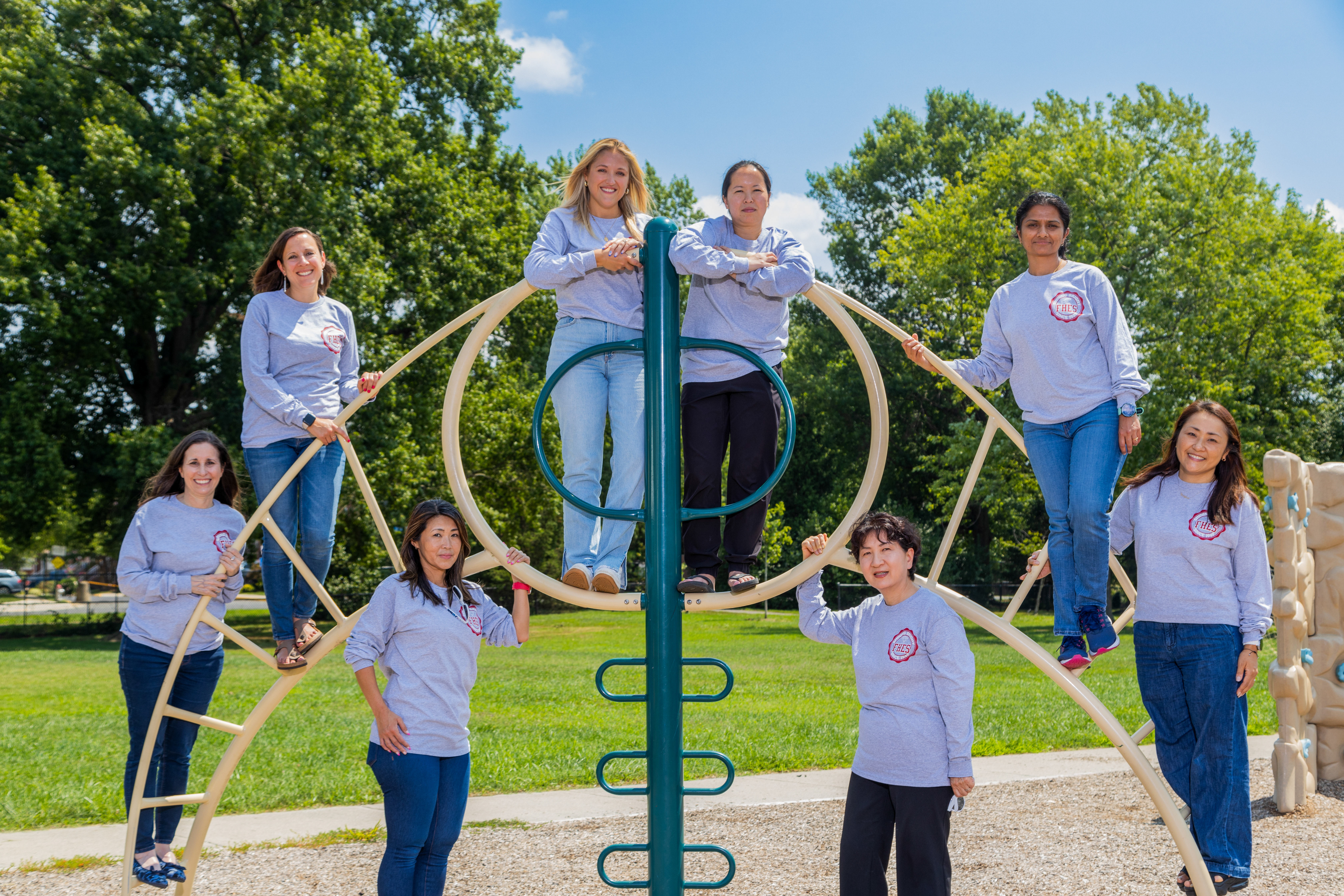 staff smiling on playground